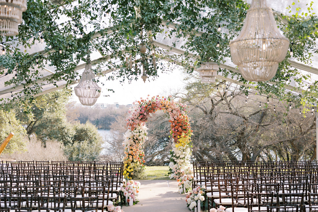 outdoor wedding with arch and hanging installation austin texas florist
