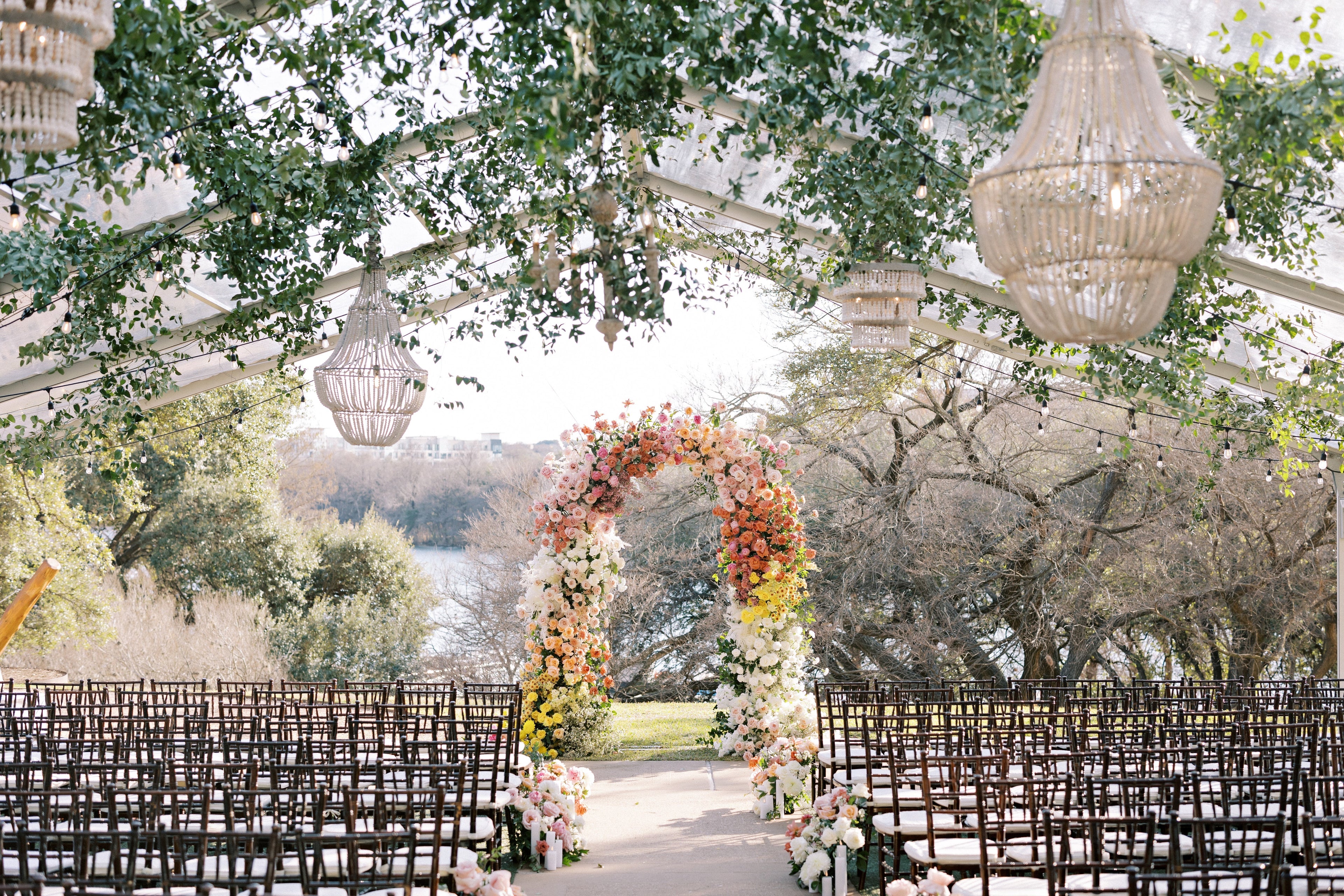 outdoor wedding with arch and hanging installation austin texas florist
