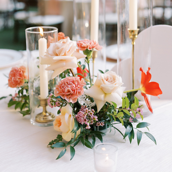 Wedding centerpiece with Candles for Hill country Austin reception with roses and carnations