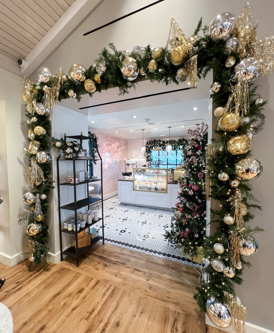 interior retail christmas garland over doorway tinsel gold and silver