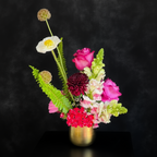Small flower arrangement in austin texas contains bright vibrant roses and snap peas for affordable online floral delivery 